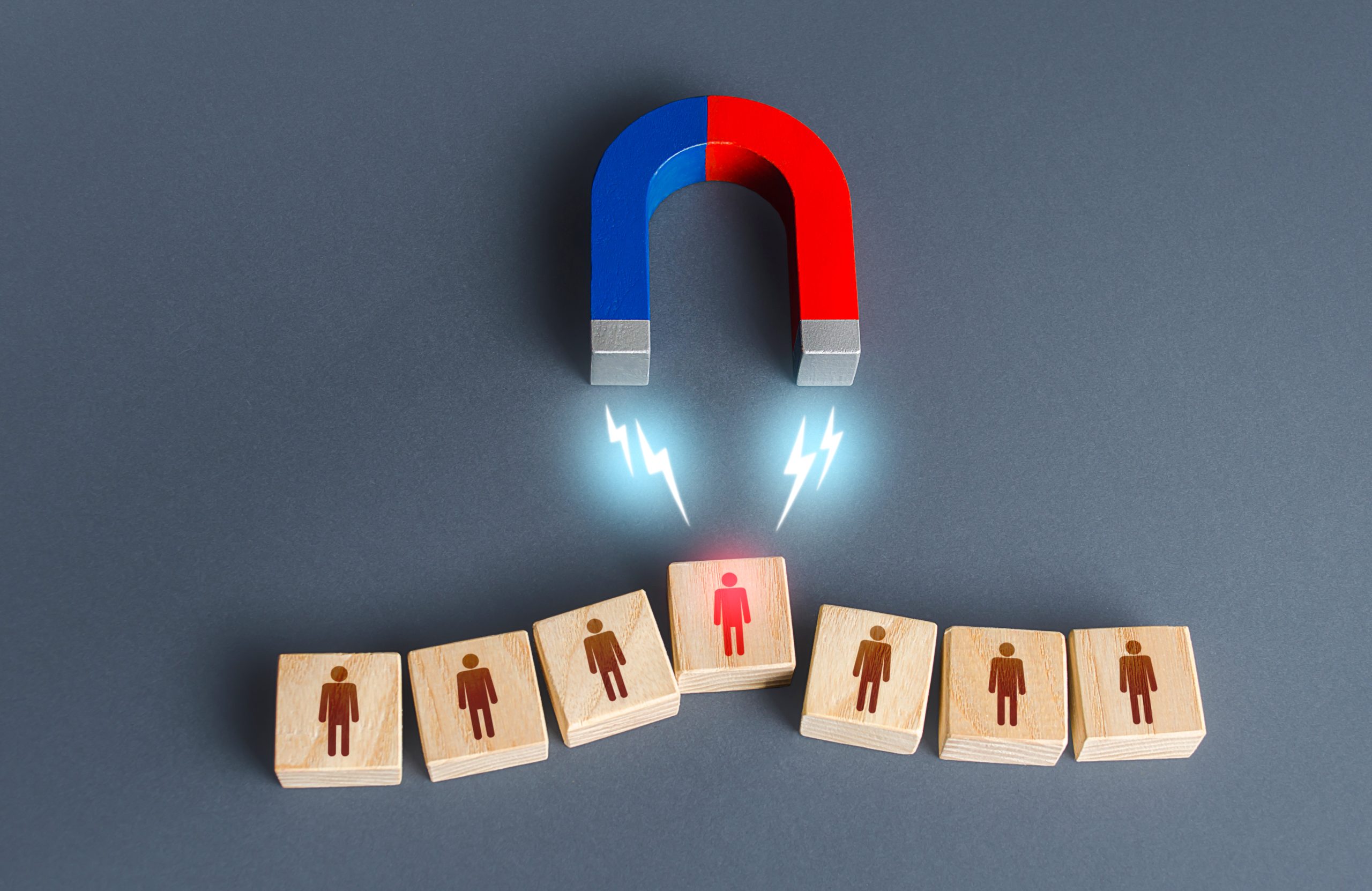 magnet selects one person from row finding best recruiting candidate scaled